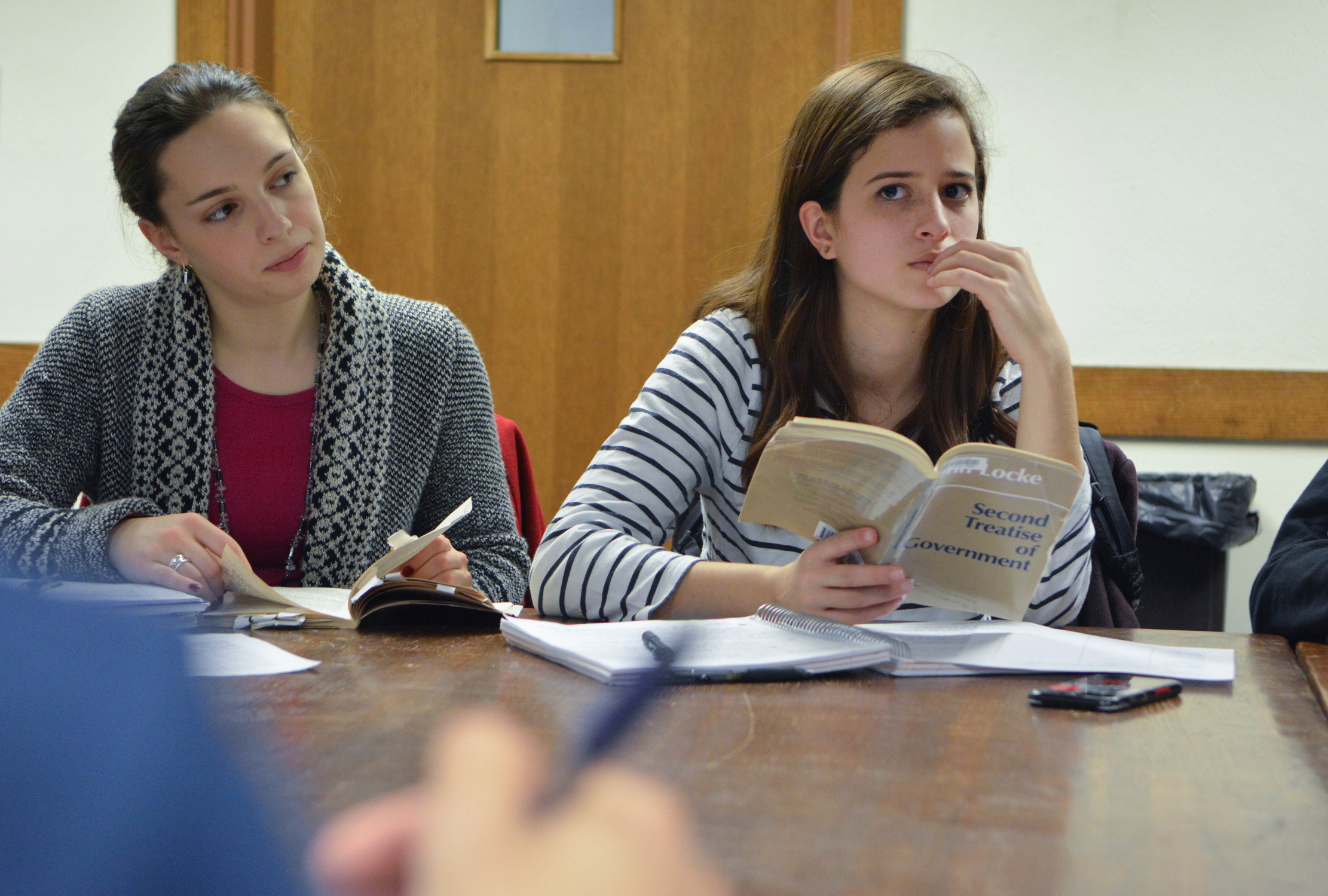 Students reading and writing in class